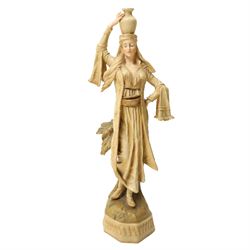 Pair of Ernst Wahliss for Turn Wien porcelain figures of Middle Eastern water carriers, taller figure H35cm