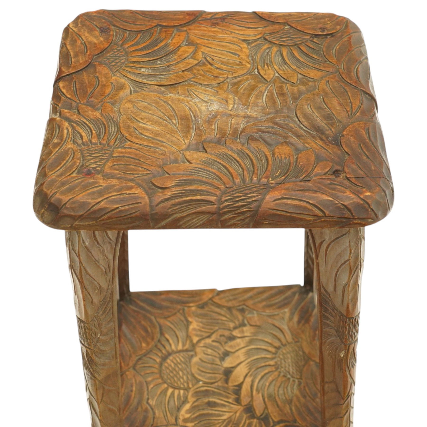Attrib. Liberty & Co. - Arts & Crafts carved Japanese pattern two-tier occasional table, the square top with rounded corners heavily carved foliate motifs, raised on tapering supports with scroll feet united by undertier