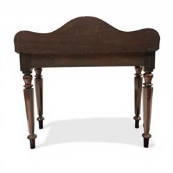 Victorian mahogany side table, raised back with scroll-moulded edge over a rectangular top, raised on turned octagonal supports