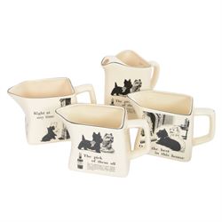 Eight Black and White Scotch Whisky advertising jugs