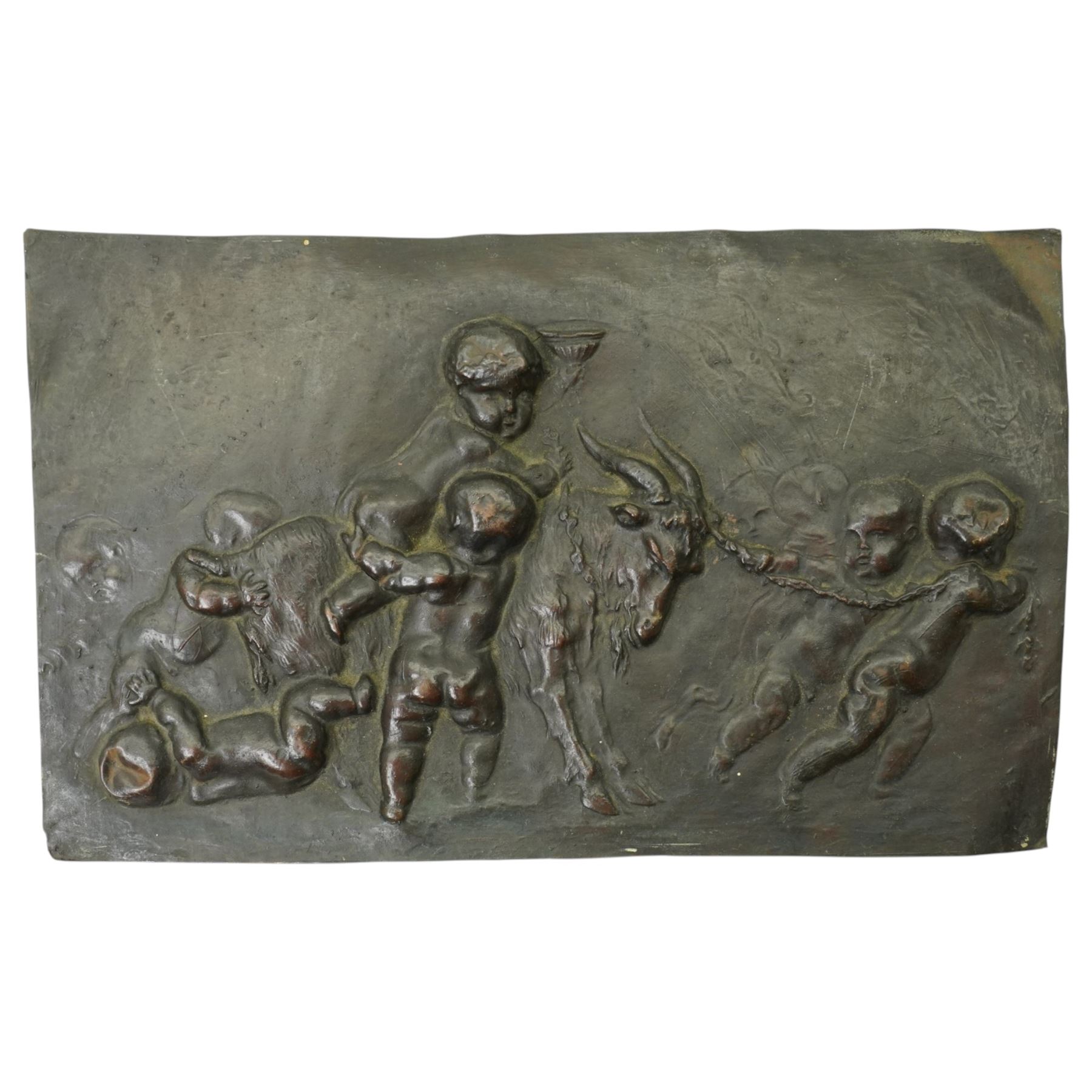 Cane handle in the form of a mongoose and snake, brass oil chamber stick, another and a copper panel decorated in relief with cherubs and a goat 20cm x 32cm