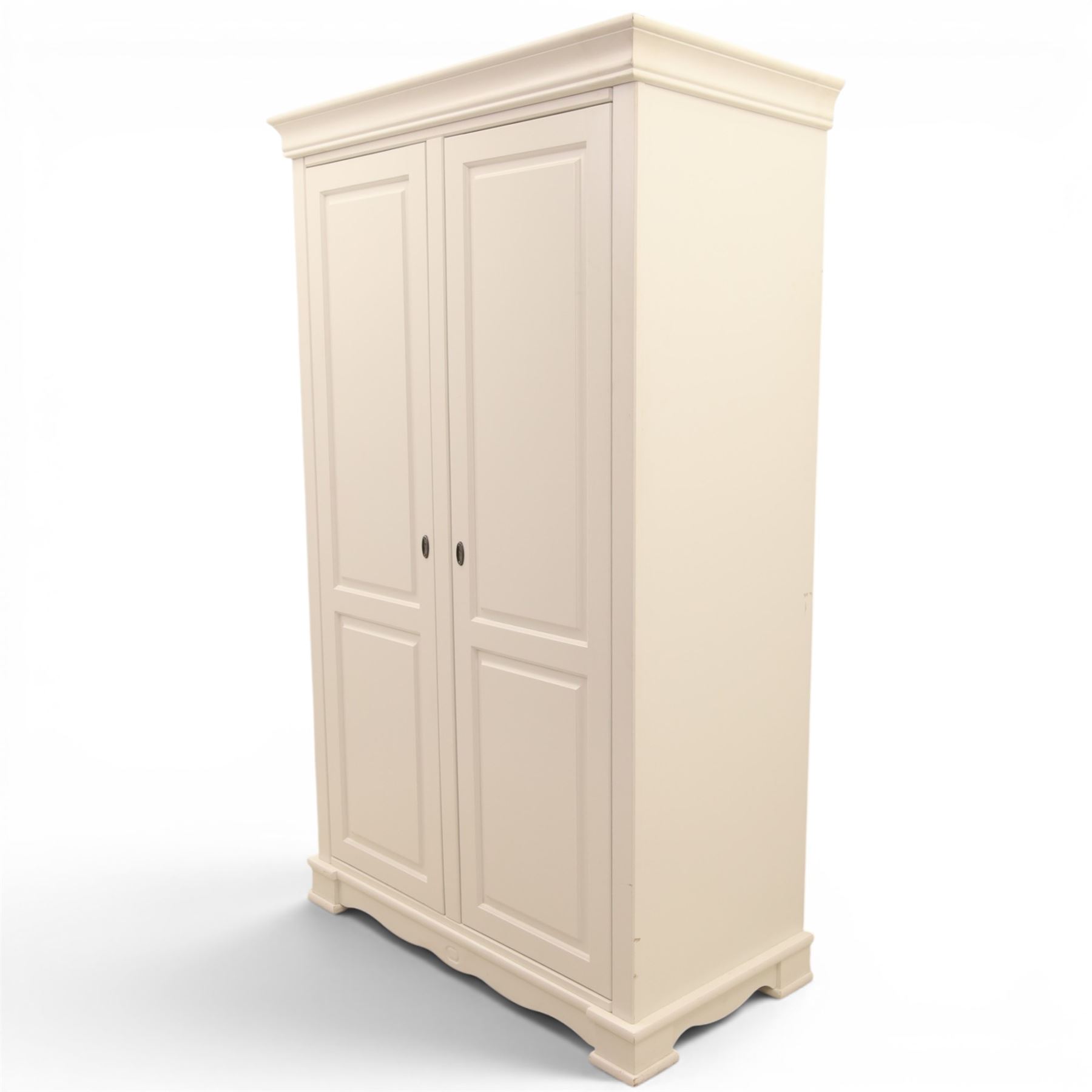 Modern white painted double wardrobe, fitted with two panelled doors, enclosing a hanging rail and shelving, raised on bracket feet