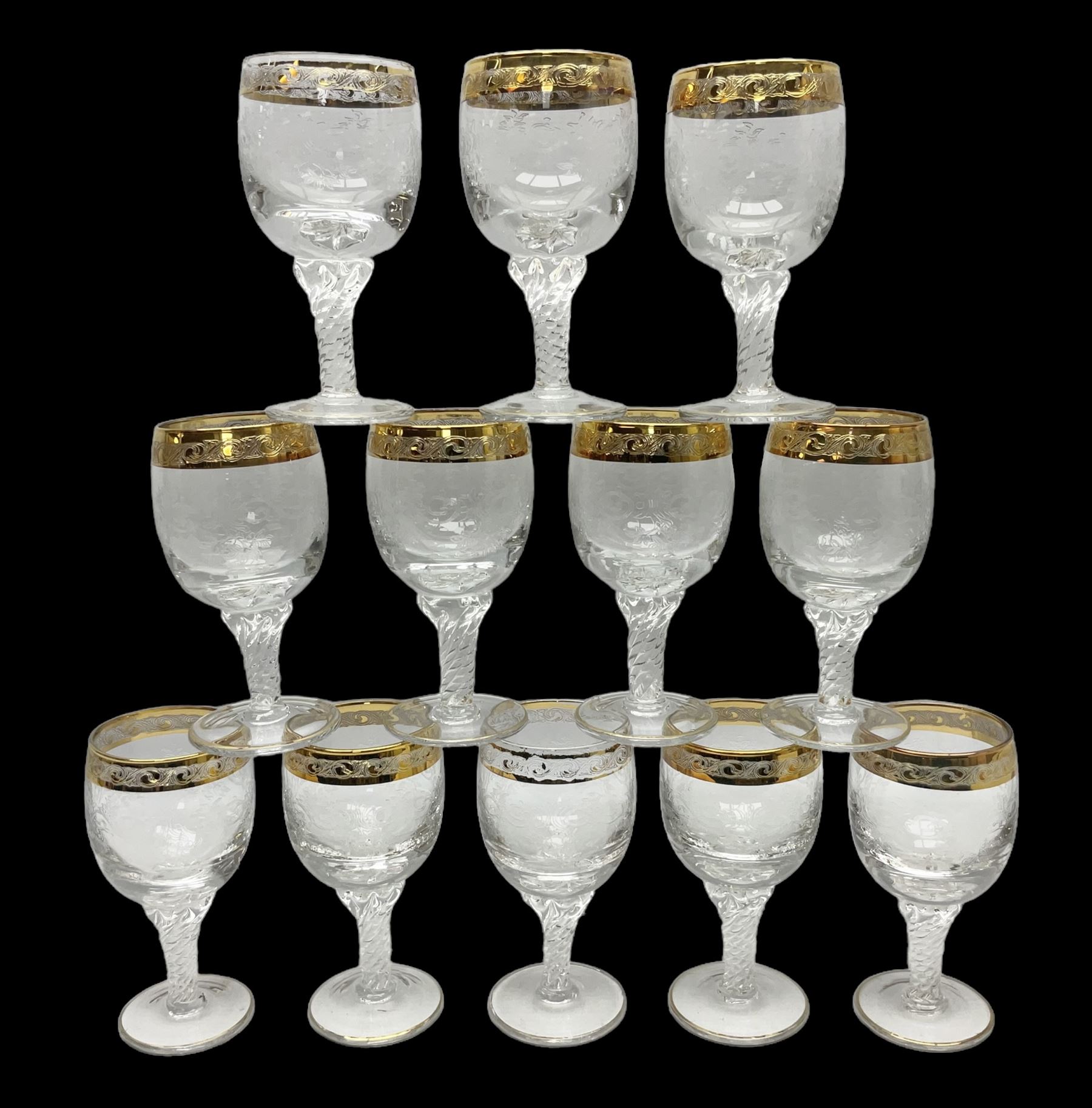 Set of twelve Moser style wine glasses, the bowls with etched floral bodies and gold banded rim with foliate decoration raised upon stem of twisted form, H14cm