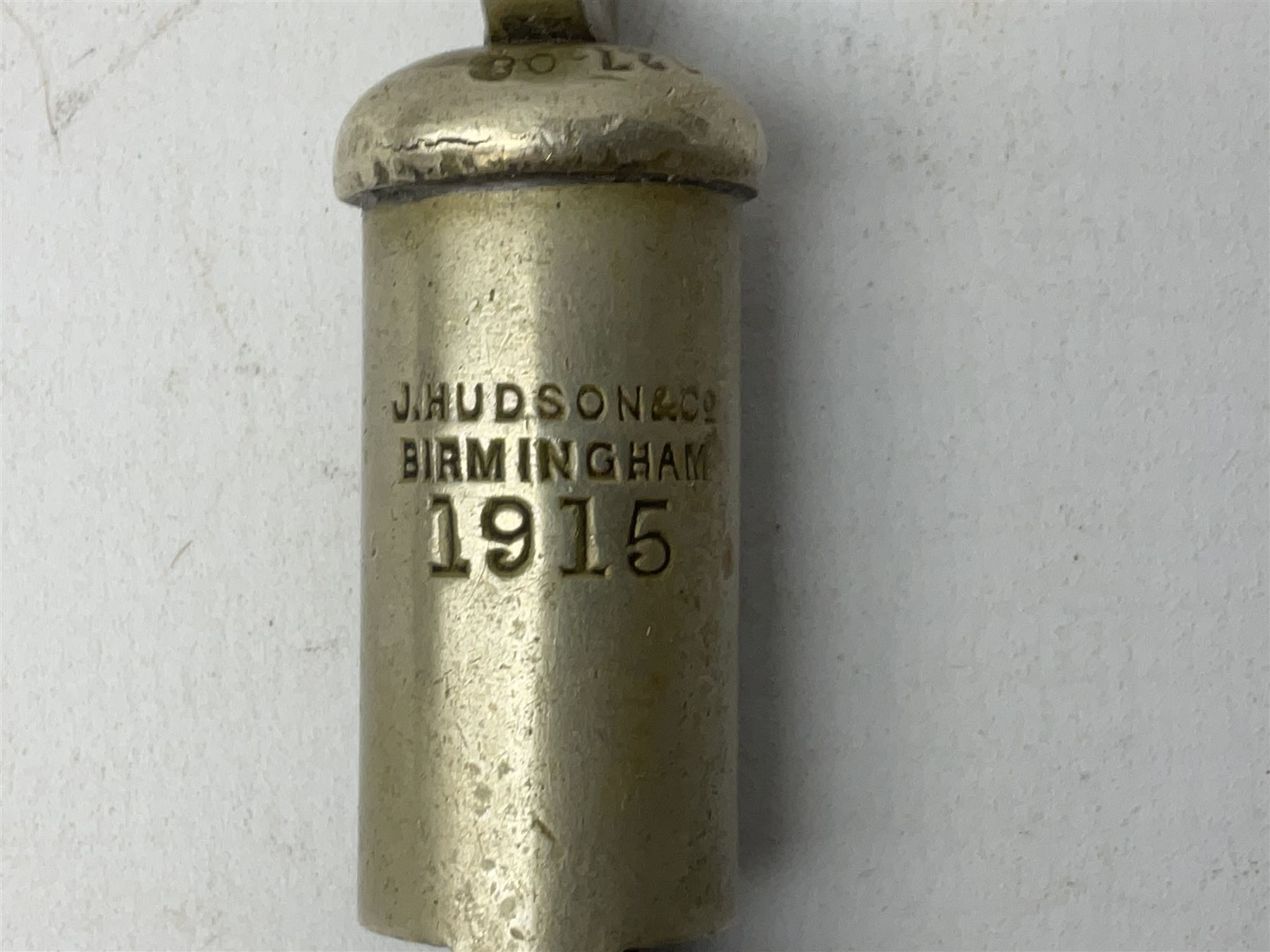 Three J Hudson & Co Birmingham military whistles, dated 1915, 1916, 1923