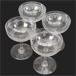 Six cut glass goblets, each with etched and cut floral decoration, together with eight similar bowls, a pair of Waterford Crystal glasses, eight champagne coupes etched with Greek Key border and four etched with floral border