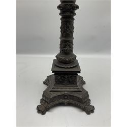 Victorian cast spelter oil lamp, the quatrefoil base on four paw feet leading to a square plinth and column decorated with putti, masks, and foliate scrolls, supporting a faceted clear glass reservoir, burner, clear glass chimney, and foliate etched clear glass shade, overall H68cm  