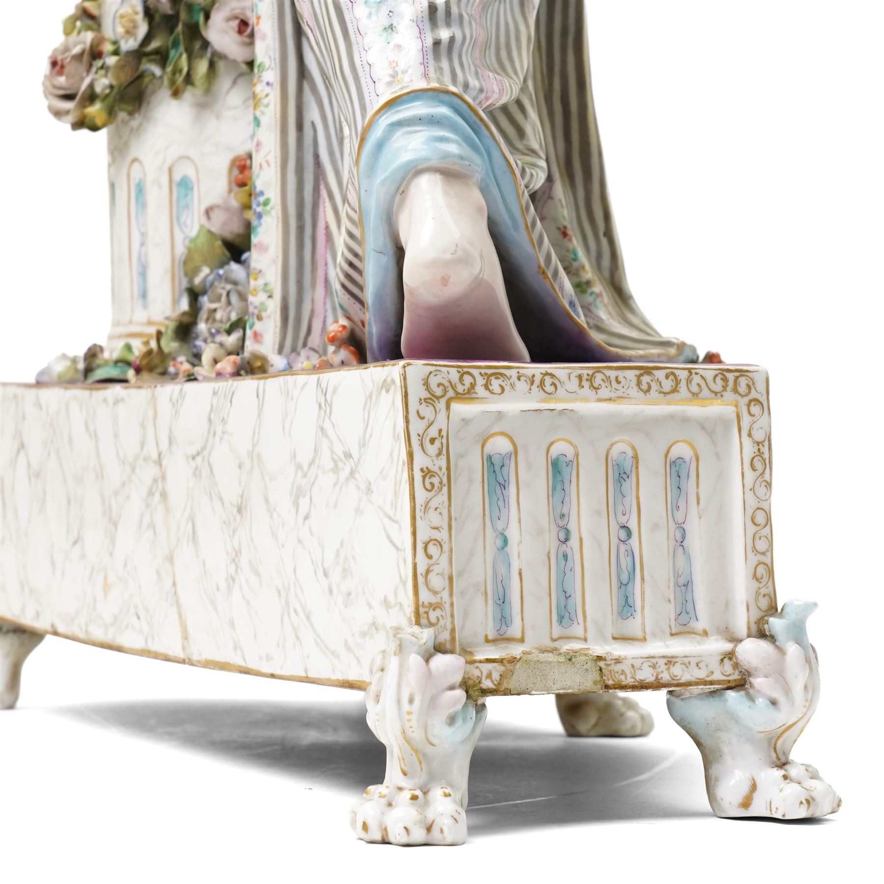 Large19th century  German porcelain mantel clock with white dial and striking movement, the case with a standing figure of Flora resting on a pillar with floral applied decoration, the base painted eith landscape and floral panels on paw feet H77cm W43cm