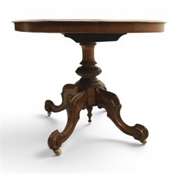 Victorian mahogany oval centre table, raised on turned column with four carved legs, ceramic castors