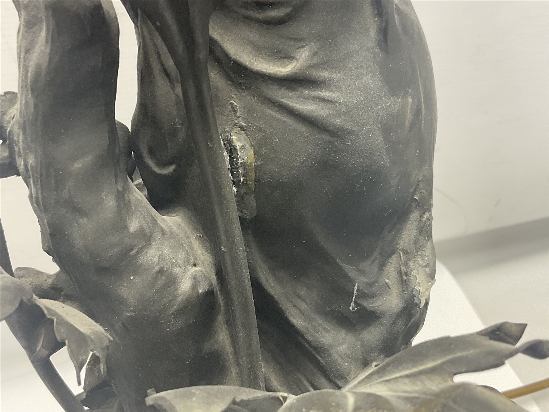 Pair of Art Nouveau style spelter figural table lamps, each mounted on rouge marble effect circular bases, with toleware flower heads and leafy decoration surrounding a female figure, H90cm