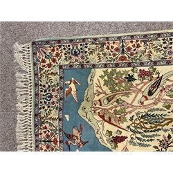 Fine Persian tree of life rug wall hanging, ivory ground field depicting landscape filled with animals, birds and flowers, the guarded border with stylised flower heads and foliage decoration, with brass hanging rail