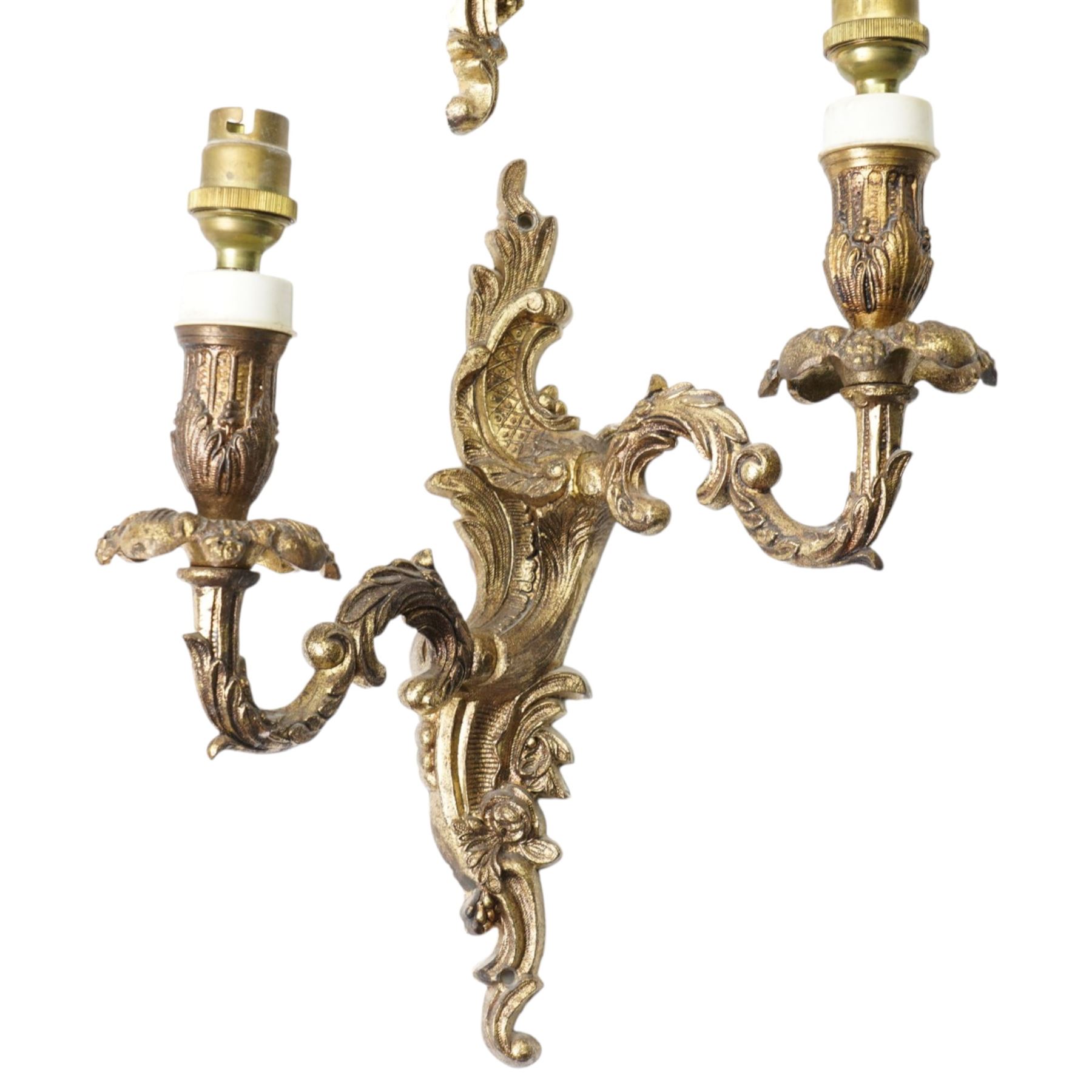 Three brass two branch wall lights and  a pair of single wall lights