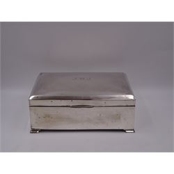 1920s silver mounted presentation cigarette box, of rectangular form, with engraved initials J.W.J and dated 1902-1927 to slightly domed hinged cover, opening to reveal compartmentalised softwood interior, upon four bracket feet, hallmarked Birmingham 1920, maker's mark worn and indistinct, H9cm, W23cm, reputedly given to John William Johnson, father of Amy Johnson,  famous for being the first long distance (to Australia) solo female pilot, and first female British grounds engineer, for his silver wedding anniversary