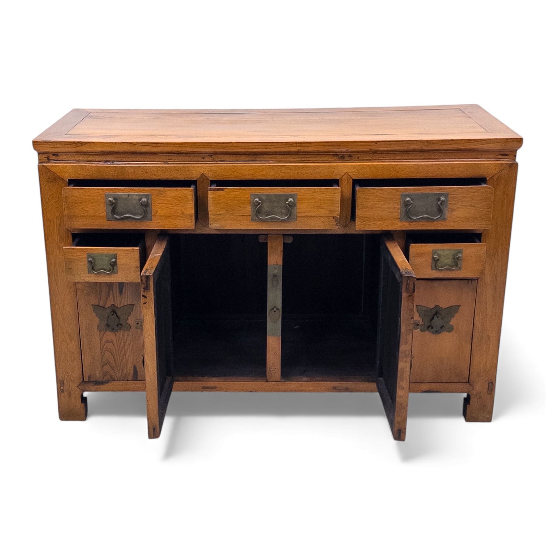 Late 20th-century Thai elm sideboard fitted with an arrangement of three drawers over a central cupboard flanked by a further two drawers, raised on square post feet 