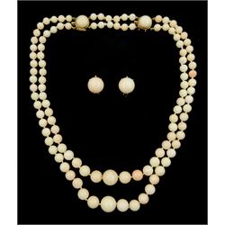 Double strand graduating angel skin coral bead necklace, with 14ct gold double clasp, , with a pair of matching clip-on earrings, both stamped 14K