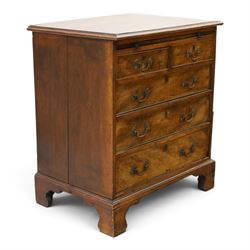 George III mahogany bachelors chest, rectangular top with moulded edge, fitted with brushing slide over two short and three long cock-beaded drawers with brass swan-neck handles, lower moulded edge on bracket feet