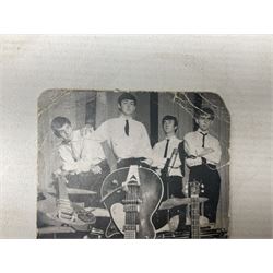 The Beatles - Parlophone Records promotional photographic card depicting a very young group standing together behind a pile of musical instruments; signed verso by George Harrison, Ringo Starr, Paul McCartney and John Lennon, inscribed by two members to 'Janet' and also signed by a female 'roadie' F. Holly who had been assigned to look after her 14.5 x 9cm
Provenance: The signatures were obtained by 'Janet', the vendor, at the Majestic Ballroom, Witham, Hull, at their performance on 13th February 1963, when she was sixteen years old. Janet was still recovering from being injured in a car accident so was removed from the packed audience to watch the performance from the wings where she acquired the signatures, personally watching each member of the band sign the card. Whilst signing the card the Beatles asked her to attend a party later that night at their hotel in Hull but she declined as she was too young and had to return home by 11pm!