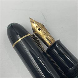 Pelikan Souveran 140 fountain pen, the green and black striped barrel and cap with gold plated beak shaped clip and bands, with gold nib stamped 14C-585, together with matching push ballpoint pen, largest L13cm