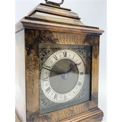 Small late 20th century walnut cased bracket clock. sarcophagus top with brass loop handle, brass dial with silvered Roman chapter ring and ornate spandrels, single train movement by 'Buren'