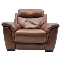DFS - 'Liaison' reclining armchair upholstered in brown leather, upholstered in tan leather with stitched panel backrest and generously cushioned seat and arms, operated by wired remote, raised on block feet