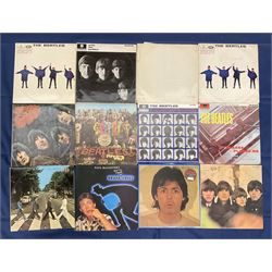 The Beatles vinyl LPs including 'The White Album' no 0260028 with poster', 'Help', 'Rubber Soul', 'Sgt. Peppers Lonely Hearts Club Band', 'A Hard Day's Night' etc (12)