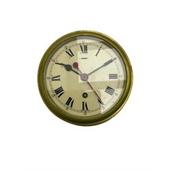 A 20th century eight-day English brass cased bulkhead clock, with a 6” painted dial, roman numerals with Arabic five-minutes and minute track, black spade hands and red baton centre sweep seconds hand, with a brass bezel and flat bevelled glass, spring driven lever platform movement with regulation and timing screws.