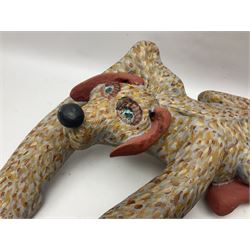 Helen Skelton (British 1933 – 2023): Two carved wooden abstract sculptures, one modelled as a dog, the other modelled as a bear, both with painted stippled decoration, largest H20cm. Born into an RAF family in 1933 in Kent and travelled the world extensively during her childhood. After settling in Bridlington, Helen immersed herself in painting, textiles, and wood sculpture, often inspired by nature's beauty. Her talent was showcased in a one-woman show at Sewerby Hall and recognised with the sculpture prize at Ferens Art Gallery in 2000. Sadly, Helen’s daughter passed away from cancer in 2005. This loss inspired Helen to donate her sculptures to Marie Curie upon her passing in 2023.