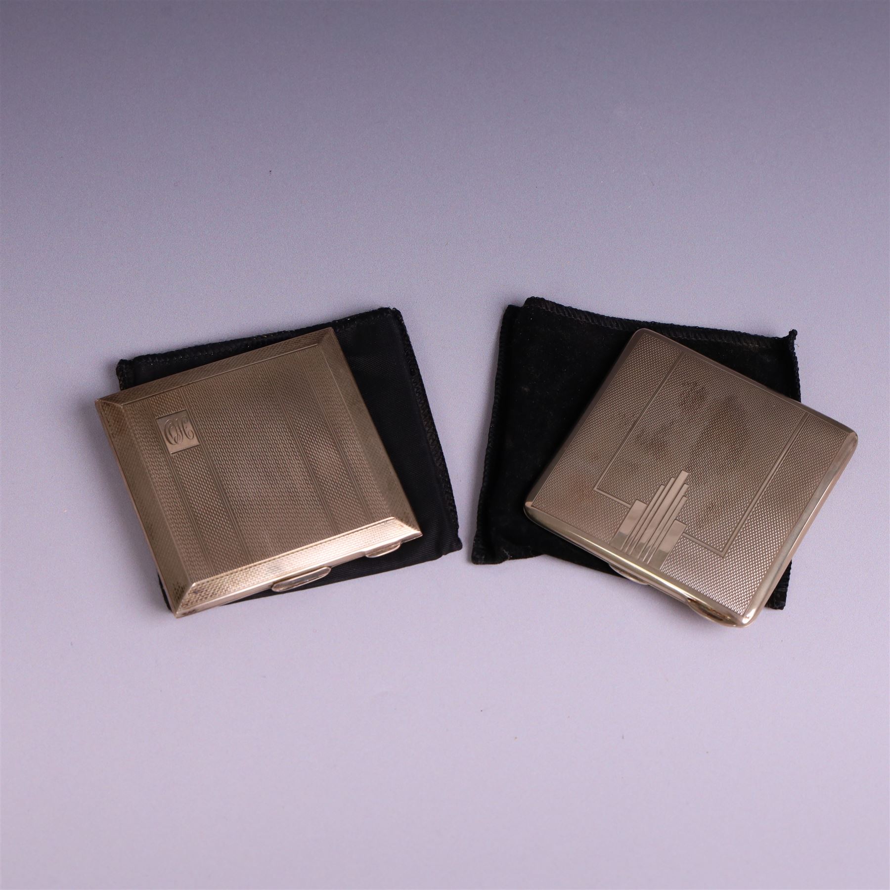 Two mid 20th century silver compacts, both rectangular with engine turned decoration, one with engraved monogram to cover, hallmarked Randle Brothers, Birmingham 1946, the other with personal engraving to interior, hallmarked William Suckling Ltd, Birmingham 1947, H7cm, both in fabric pouches