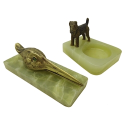  Late 19th century bronze Paperclip in the form of a birds head, with green jeweled eyes on rectangular onyx plinth and a similar Ashtray set with an Airedale, W13cm max (2)  
