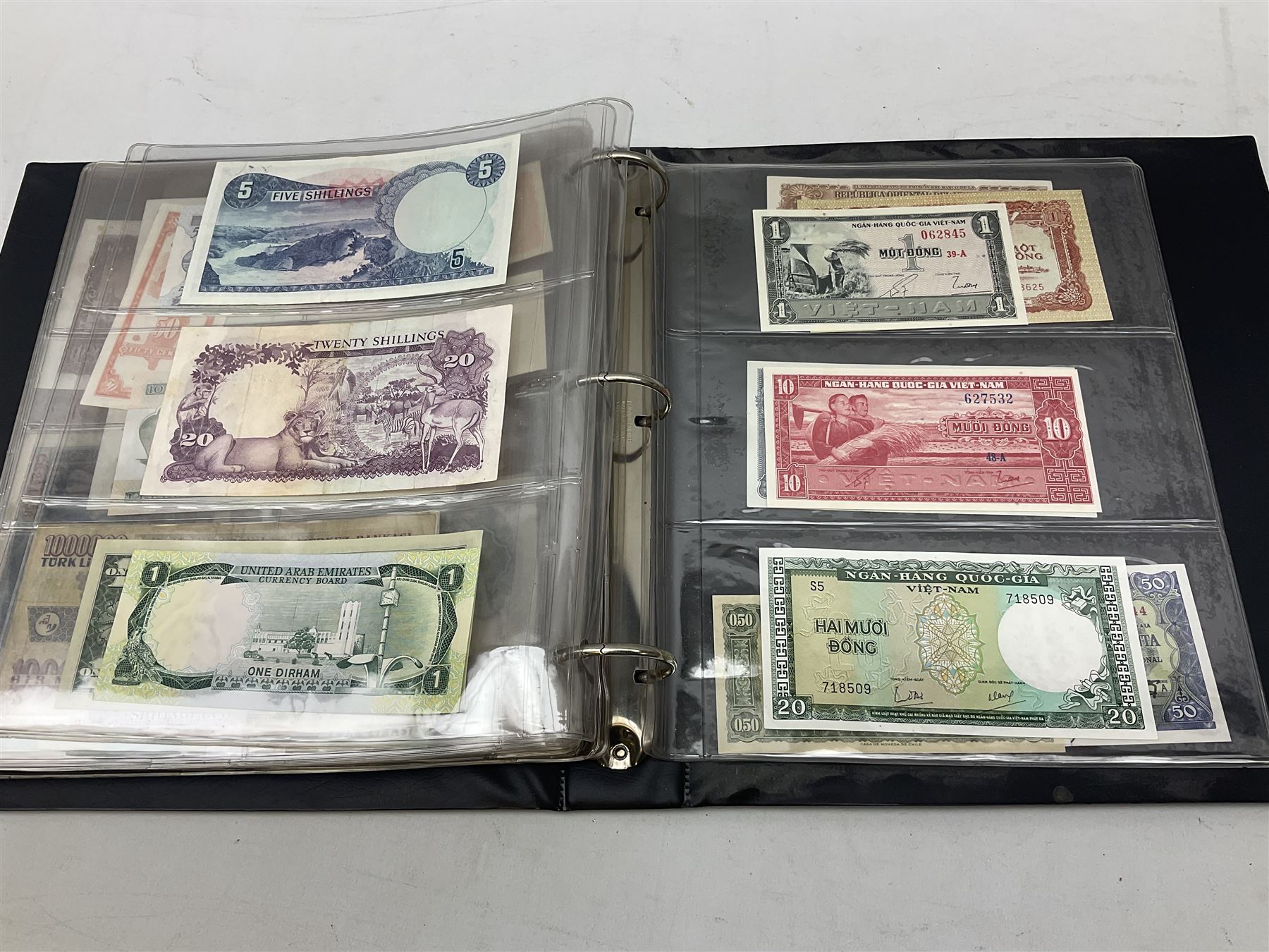 World banknotes, including Queen Elizabeth II The States of Jersey one pound 'DB202703', five pounds 'BB527762' and ten pounds 'AB651481', reserve bank of New Zealand two dollars '1L3 741894', King George V Straits Settlements one dollar 1st January 1935 'F/83 28924', various Bank of England notes etc, housed in two ring binder albums