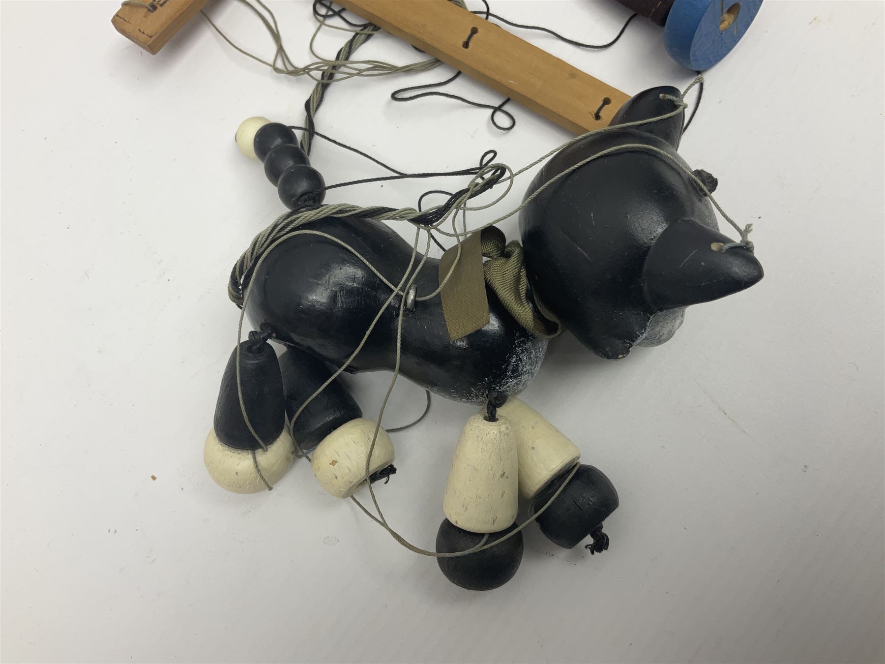 Pelham Puppet - three puppets comprising a painted wooden duck with felt mouth and wings with metal joints H12cm, in original box and instructions; and two further examples Type A cat with a hollow body H12cm, and a boy H23cm (3) 