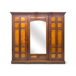 Early 20th century walnut wardrobe, projecting cornice over two panelled doors with contra...
