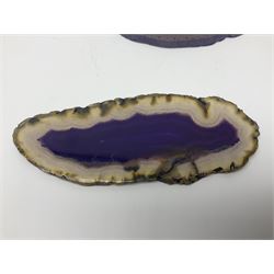 Four purple agate slices of various sizes, polished with rough edges