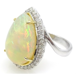  18ct white gold pear shaped opal and diamond cluster ring, stamped 750, opal 4.4 carat   