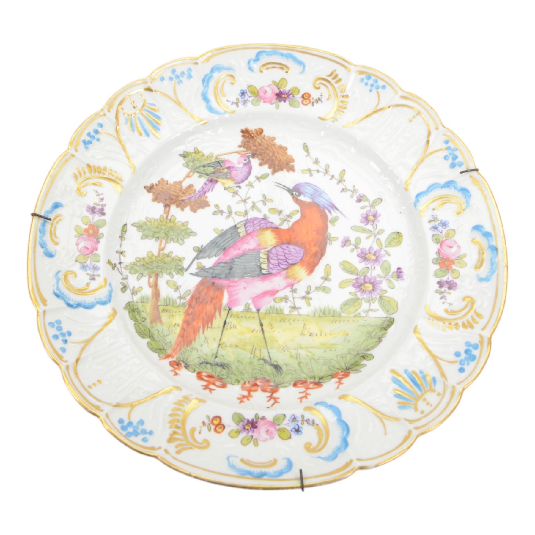 Two 19th century Samson porcelain plates, decorated in the Chelsea style with exotic birds, flowers and insects, each with spurious gold anchor mark verso, largest example D24cm, together with a 19th century dessert plate, possibly Worcester, hand painted with a hummingbird, within a gilt band and pink border, D22.5cm, and a further 19th century dessert plate with shaped and pierced rim, hand painted with a view of Loch Lomond and titled verso, D22cm, (4)