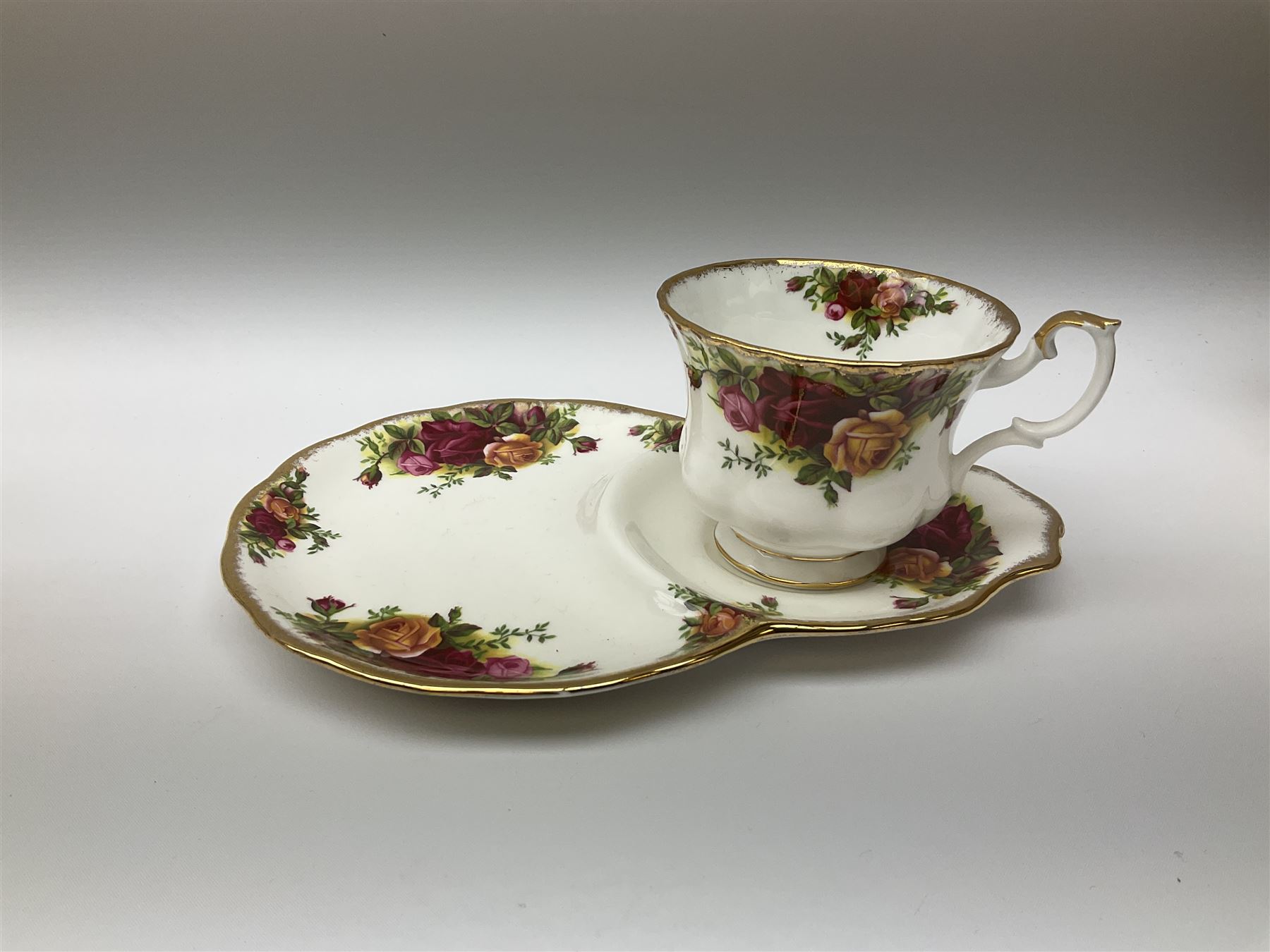 Royal Albert Old Country Roses pattern tea set, comprising teapot, coffee pot, six teacups and six saucers, five side plates, further teacup with joined saucer and side plate, open sucrier, milk jug, cake plate, and preserve pot and cover, together with Royal Albert Jubilee Rose pattern sauce boat and stand, and Royal Albert Lavender Rose pattern cake stand. 