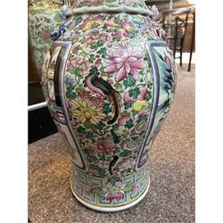 Large pair of 19th century Cantonese famille rose vases, each painted with various courtly scenes, including a display of warriors fighting on horseback before an official and his attendants, double Buddhist lion handles and applied at the shoulders with chilong, the lower band painted with Greek key motif, H58cm (2)