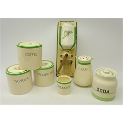  Dutch porcelain coffee grinder, Solian Ware 'Queens Green' storage jars 'Tapioca', 'Coffee', 'Ground Rice', 'Flour' sifter, 'Cream' pot and a matched 'Soda' storage jar (7)  