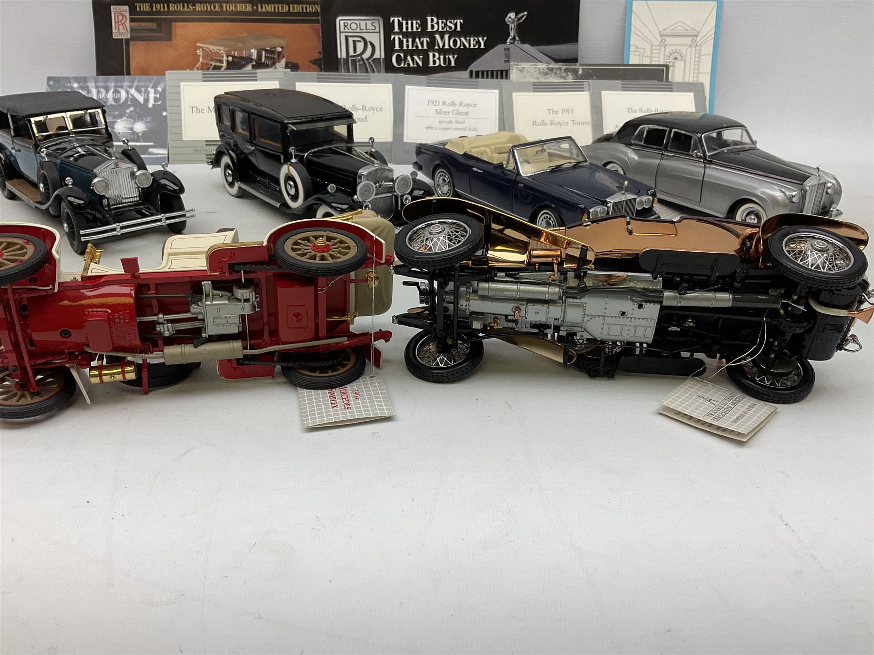 Eight Franklin Mint diecast models of cars, 1911 Rolls-Royce Tourer, The Rolls-Royce Corniche IV, The Mercedes Simplex, 1955 Rolls-Royce Silver Cloud, 1921 Rolls-Royce Silver Ghost, 1907 Rolls-Royce Silver ghost,1929 Rolls-Royce Phantom I,  and 1930 V-16 452 Cadillac Imperial Sedan, all with original tags attached