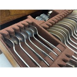 Elkington & Co part canteen of silver plated and stainless steel cutlery, to include simulated ivory handled examples, housed in oak and mahogany case, lock plate stamped 'Acme, British Made', W49cm D31cm H18cm