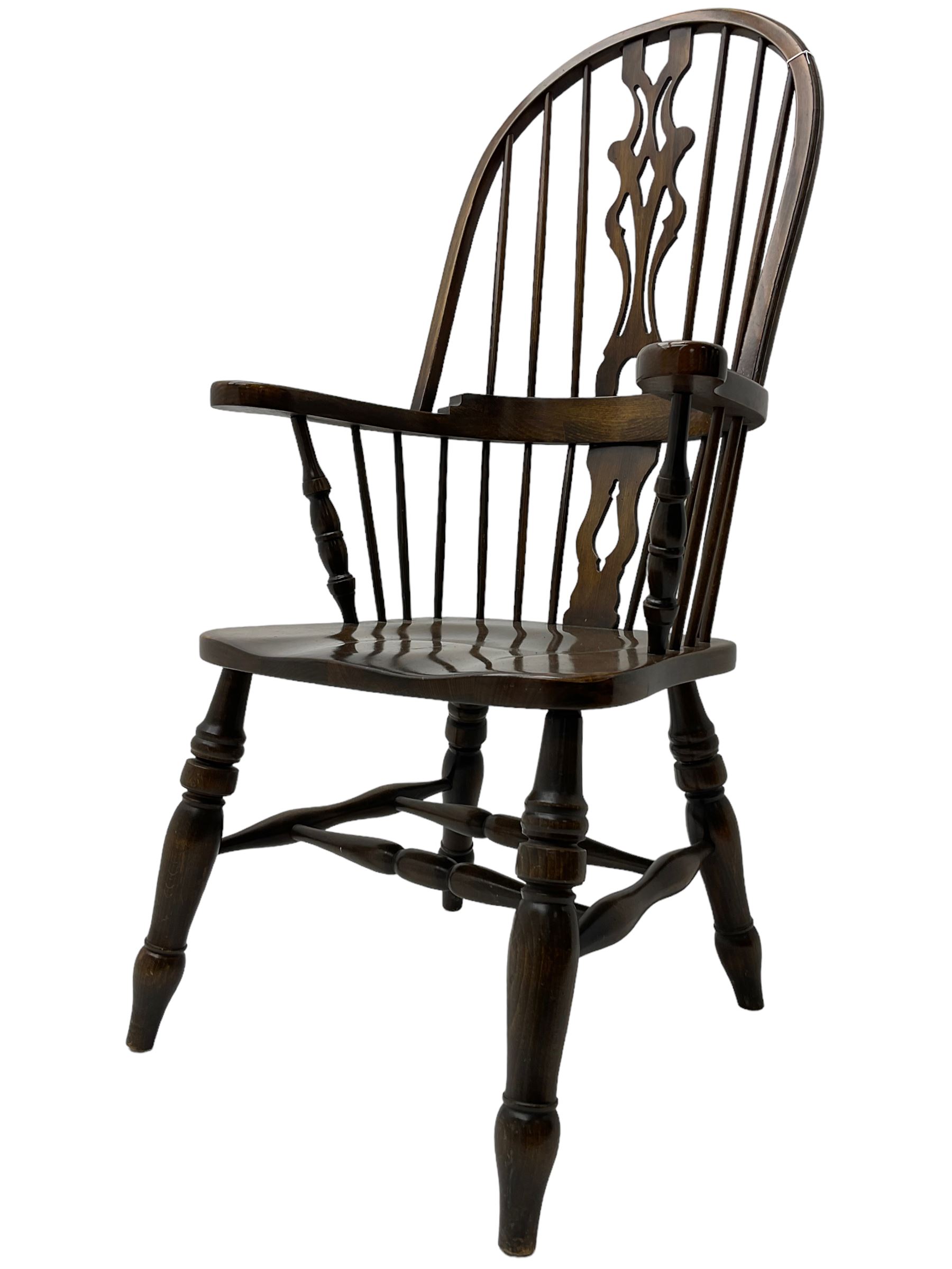 Stained beech Windsor armchair, double hoop and stick back with shaped and pieced splat back, on turned supports united by double swell-turned H stretchers
