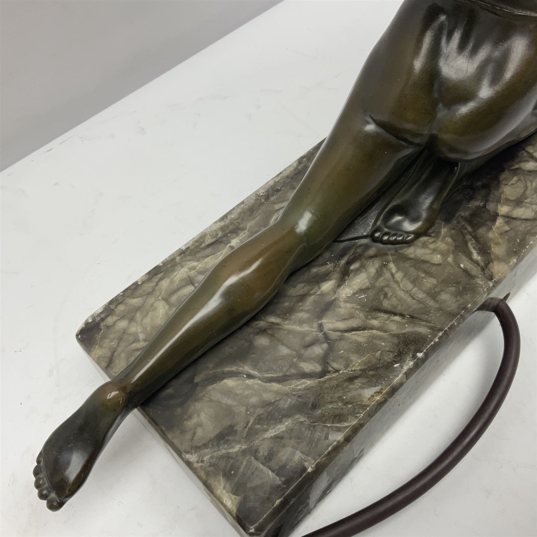 1930s Art Deco spelter table lamp, modelled as a nude woman holding aloft a spherical crizzled glass shade, upon a marble base, H48cm