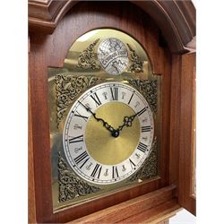 Late 20th century mahogany longcase clock, stepped arch pediment over brass dial with silvered Roman chapter ring and decorated with ornate spandrels, triple weight driven chiming movement, the interior fitted with plaque inscribed 'Designed Hand Made by Timothy Armitage of Rothwell, February 1981'