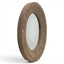 Rusticated driftwood wall mirror, of oval form, the mirror plate within a panelled driftwo...