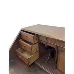 Georgian oak bureau, fall front enclosing fitted interior, four long graduating drawers, on bracket feet