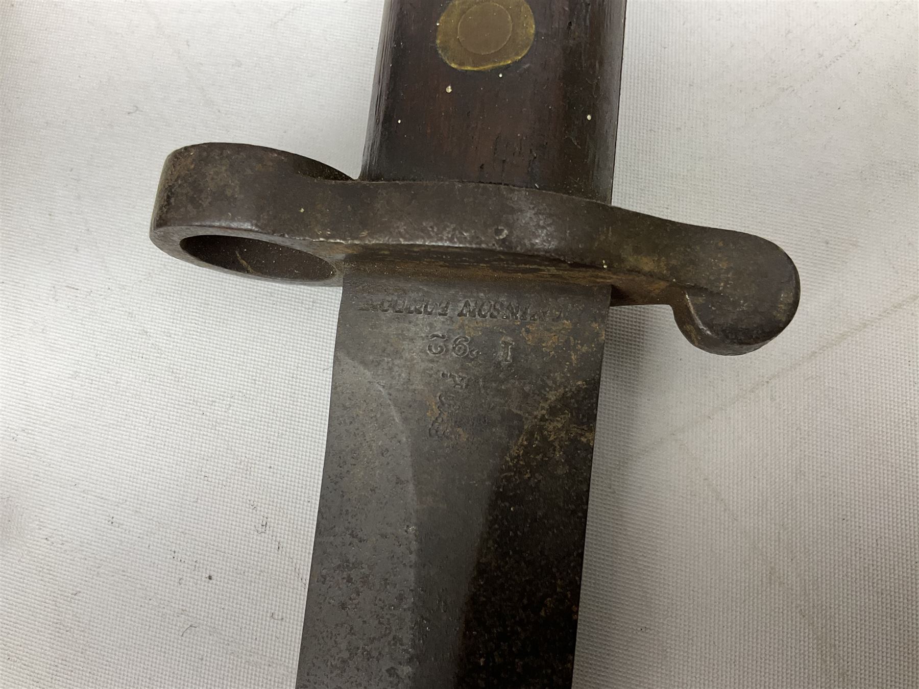 British Pattern 1907 bayonet with 43.5cm fullered steel blade; in leather scabbard with webbing frog L58cm overall; another Pattern 1907 bayonet lacking scabbard; and British Pattern 1888 Mk.I bayonet by Wilkinson London (no scabbard) (3)