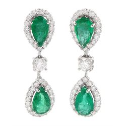 Pair of 18ct white gold pear cut emerald and diamond pendant stud earrings, the two clusters separated by a single round brilliant cut diamond, stamped, total emerald weight approx 3.45 carat, total diamond weight approx 1.75 carat