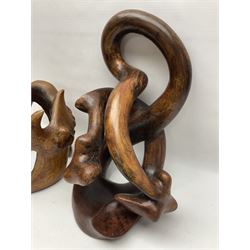 Helen Skelton (British 1933 – 2023): Two carved wooden abstract sculptures, one modelled as a entwined knot, largest H48cm. Born into an RAF family in 1933 in Kent and travelled the world extensively during her childhood. After settling in Bridlington, Helen immersed herself in painting, textiles, and wood sculpture, often inspired by nature's beauty. Her talent was showcased in a one-woman show at Sewerby Hall and recognised with the sculpture prize at Ferens Art Gallery in 2000. Sadly, Helen’s daughter passed away from cancer in 2005. This loss inspired Helen to donate her sculptures to Marie Curie upon her passing in 2023.