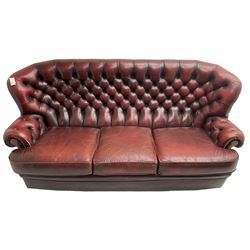 Wade - Georgian design three-seat sofa, high curved back over scrolled arms, upholstered in deep buttoned oxblood 'Pegasus' leather, on castors