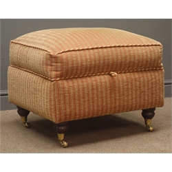  Upholstered footstool, hinged lid, upholstered in red and gold fabric, turned supports on castors, W65cm, H51cm, D54cm  