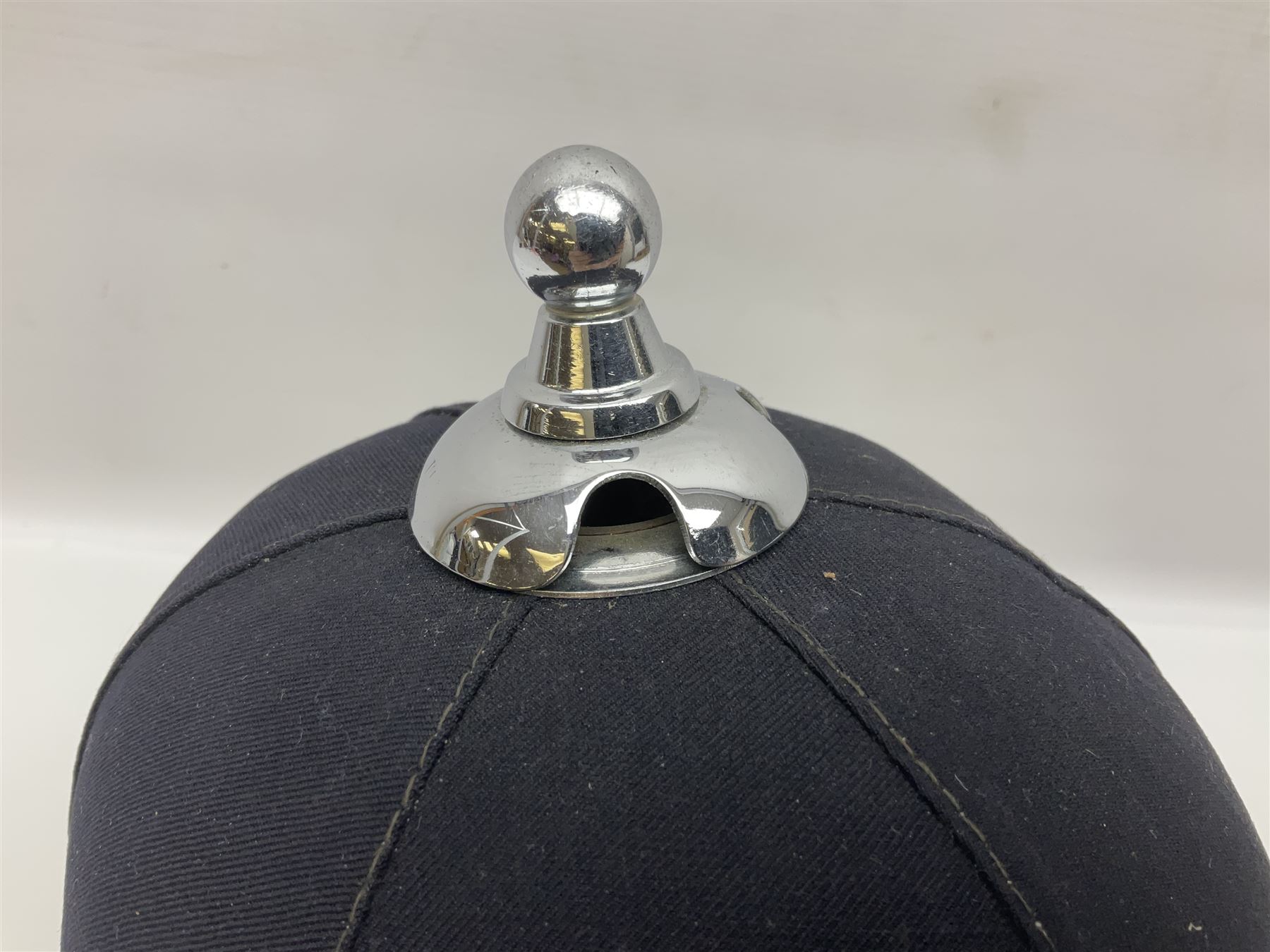 Police - Victorian turned hardwood truncheon with traces of decoration and VR cypher L42cm; Humberside Police helmet with Queens Crown helmet plate; hand lamp inscribed 'The Inspector'; and small pair of pewter figures of police officers (5)